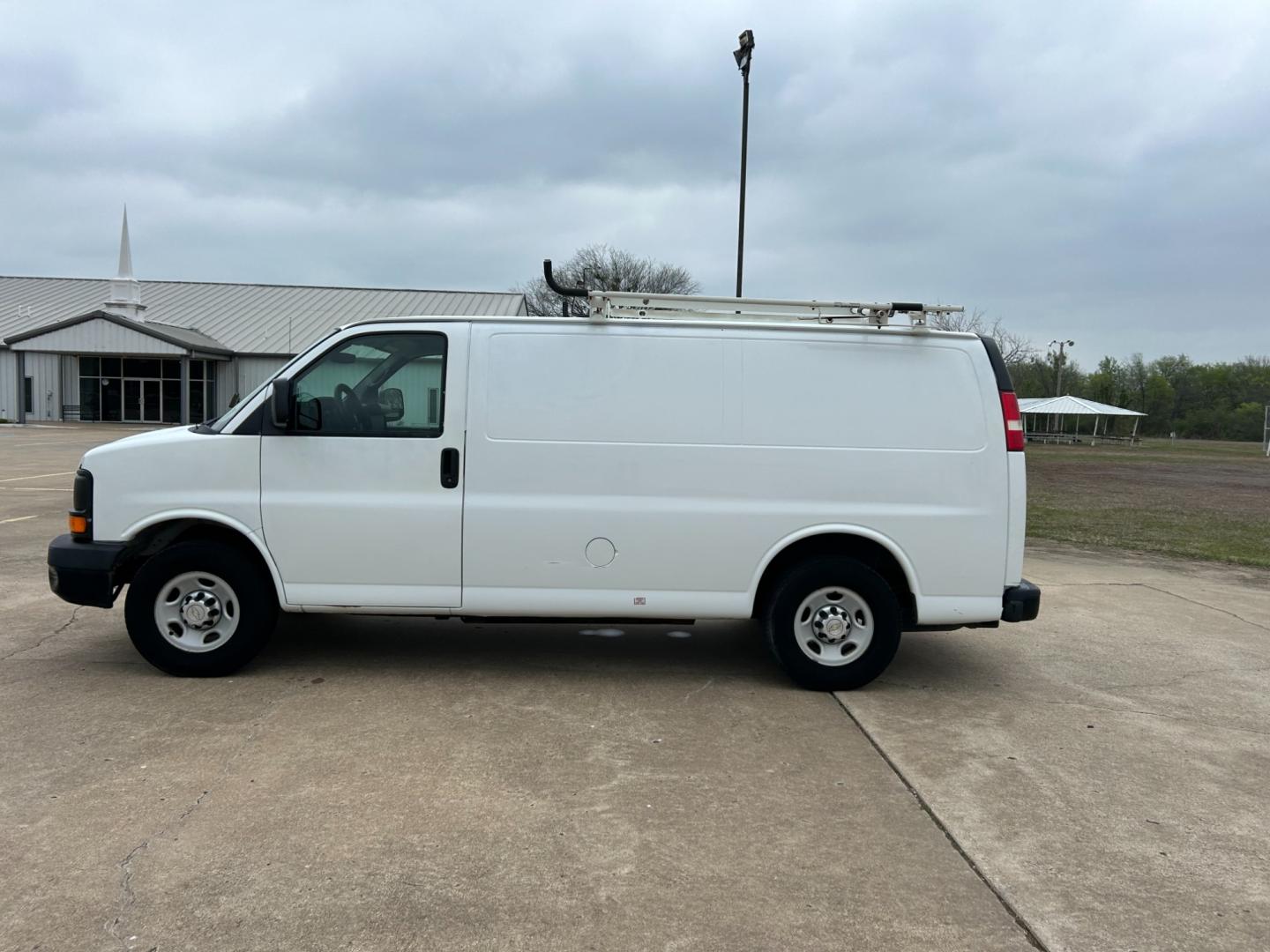 2011 White /Gray Chevrolet Express 2500 Cargo (1GCWGFCB9B1) with an 3.6L V6 DOHC 16V engine, 4-Speed Automatic transmission, located at 17760 Hwy 62, Morris, OK, 74445, (918) 733-4887, 35.609104, -95.877060 - 2011 CHEVY EXPRESS HAS THE 3.6L V6 ENGINE. THIS IS A DEDICATED CNG (ONLY RUNS ON COMPRESSED NATURAL GAS). MANUAL SEATS, MANUAL LOCKS, MANUAL, MIRRORS, MANUAL WINDOWS, AMFM STEREO, A/C, LEATHER SEATS, LEATHER-WRAPPED STEERING WHEEL, TRACTION CONTROL, LOCKING METAL CONSOLE, STEEL SHELVES, SPLIT SWING- - Photo#7